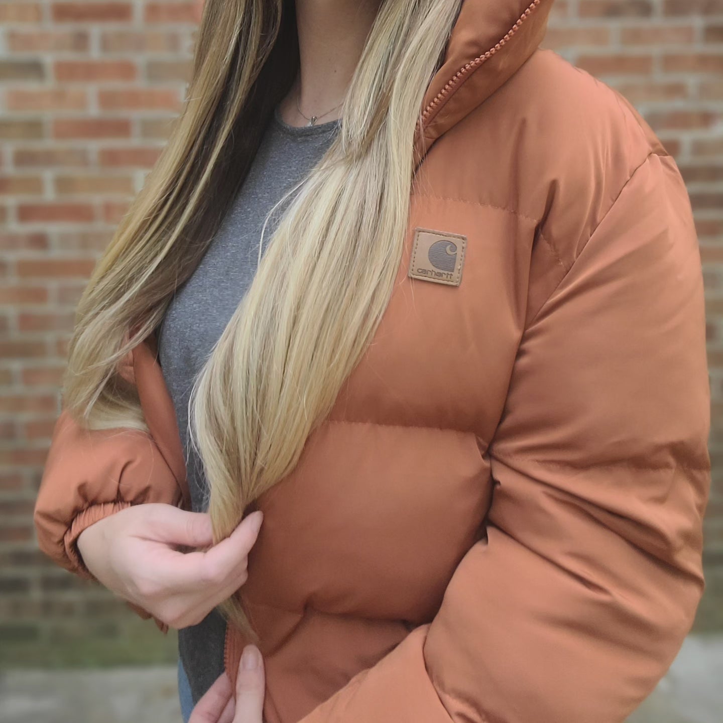 Puffer jacket with leather carhartt patch