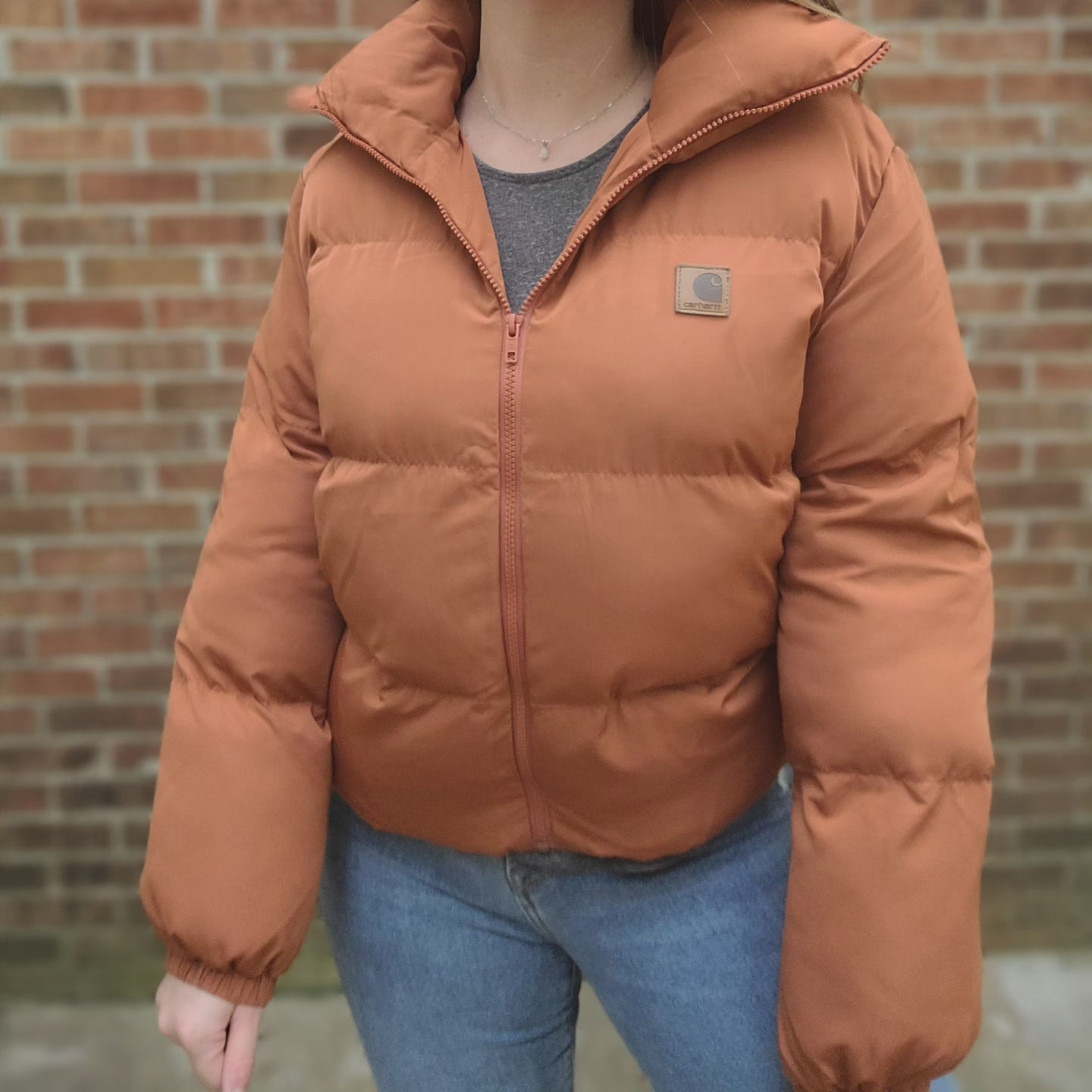 Puffer jacket with leather carhartt patch