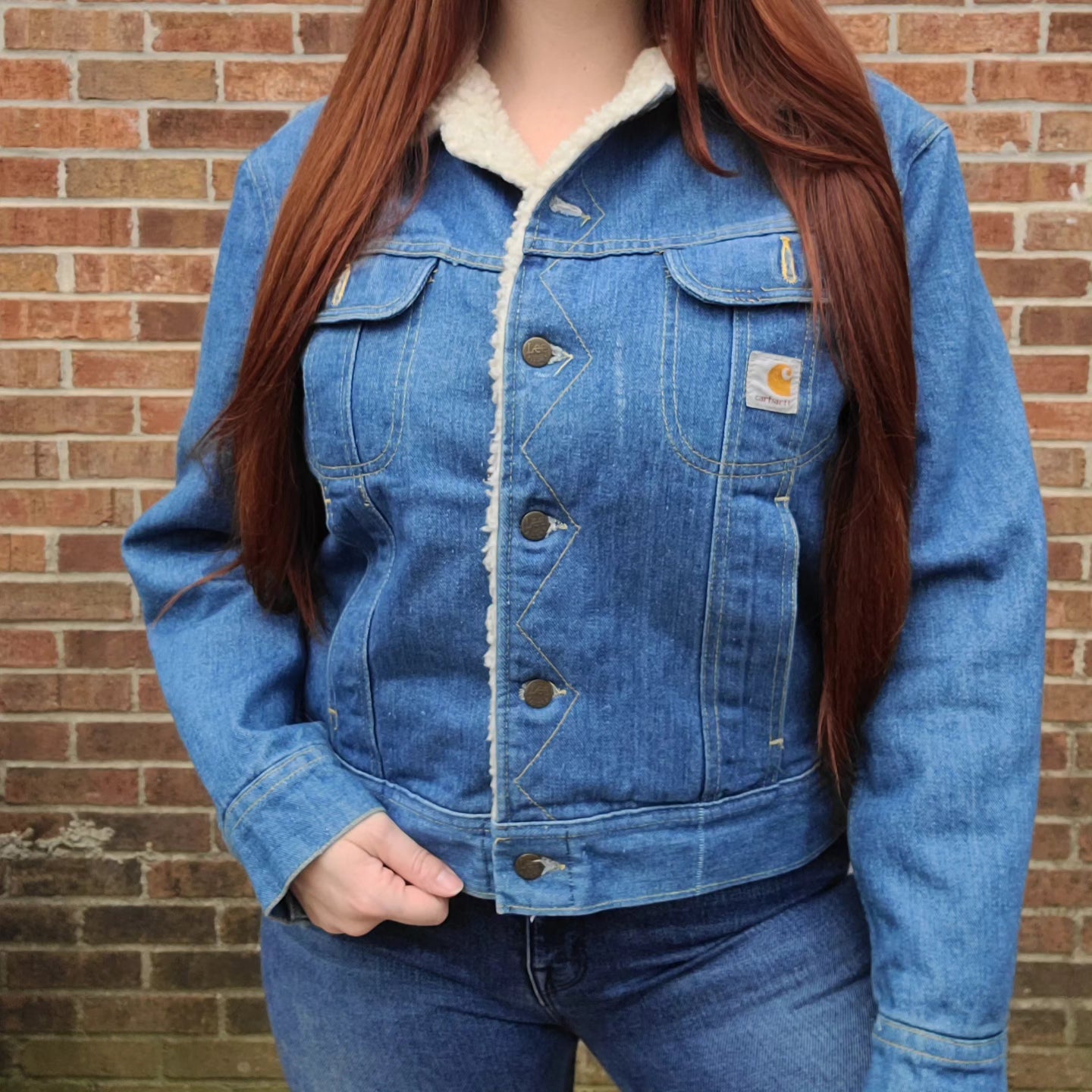 Vintage 1980s sherpa lined denim jacket with carhartt patch