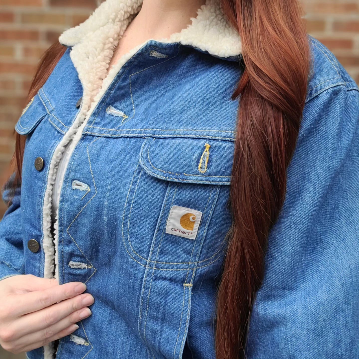 Vintage 1980s sherpa lined denim jacket with carhartt patch