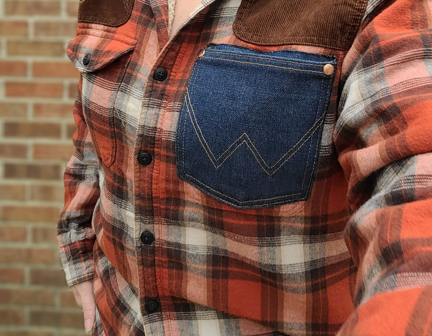 Sherpa lined flannel button-up shacket with denim wrangler pocket